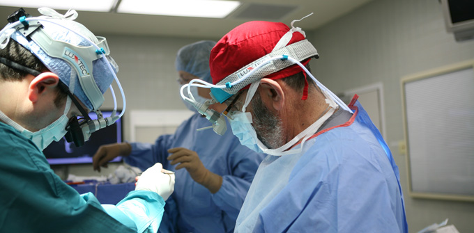 Two surgeons perform surgery 